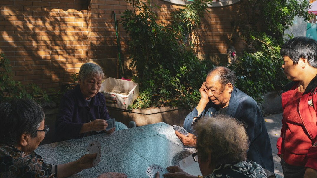 group of seniors playing cards