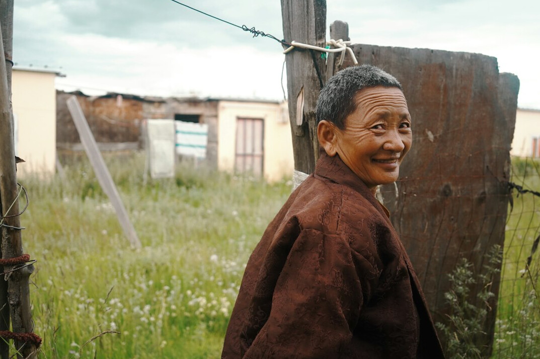 Portrait of a smiling elderly woman with short grey hair