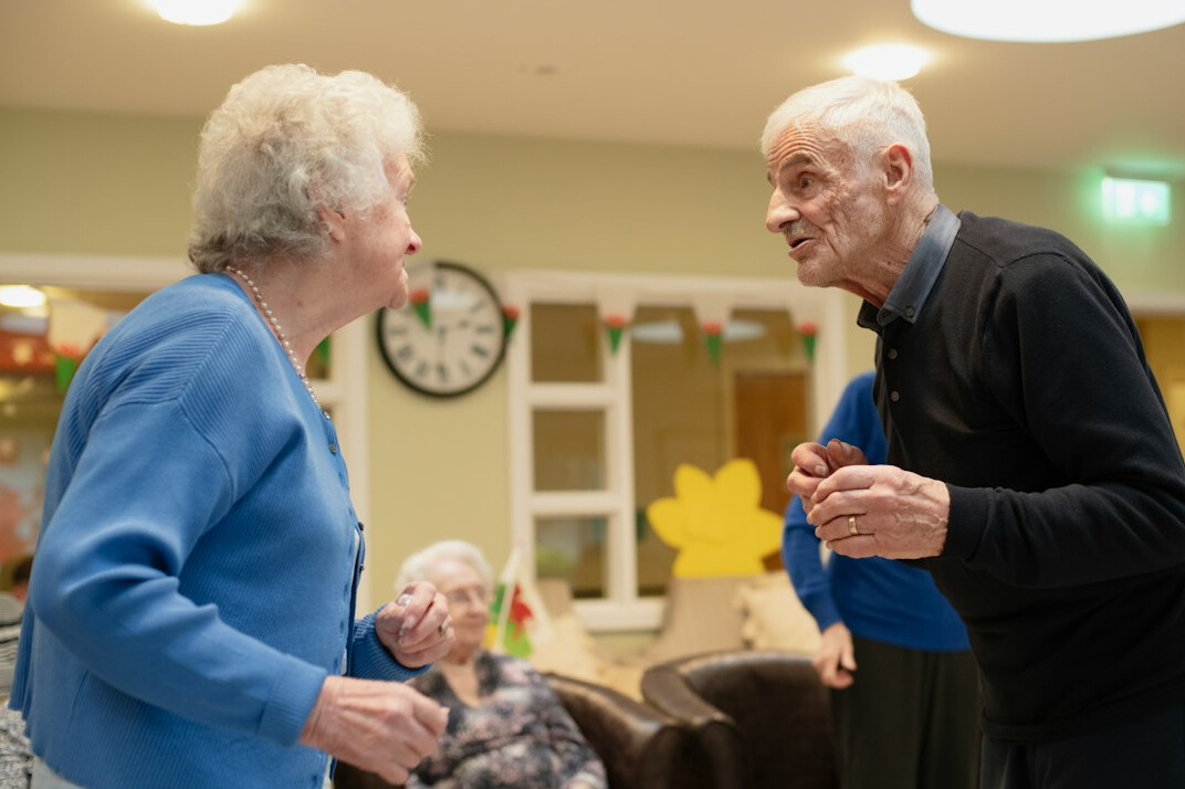 elderly people chatting in circle
